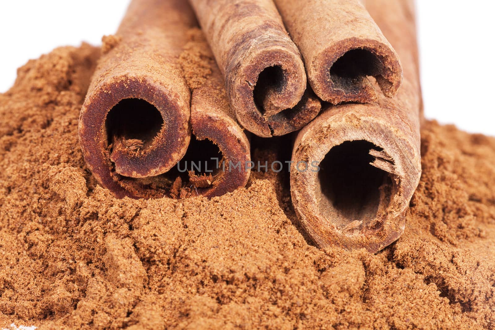 Cinnamon sticks and powder isolated on white background by mychadre77