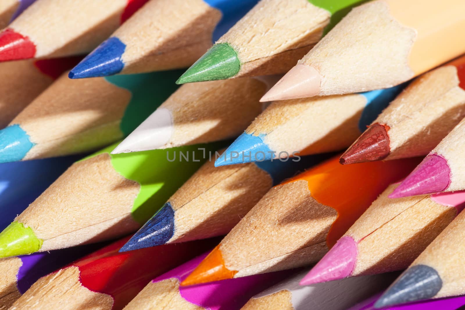  Background of chipped colored crayons, close up