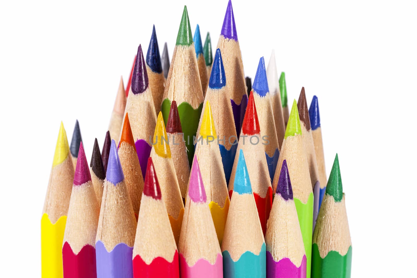 Chipped colored crayons on white background, close up by mychadre77