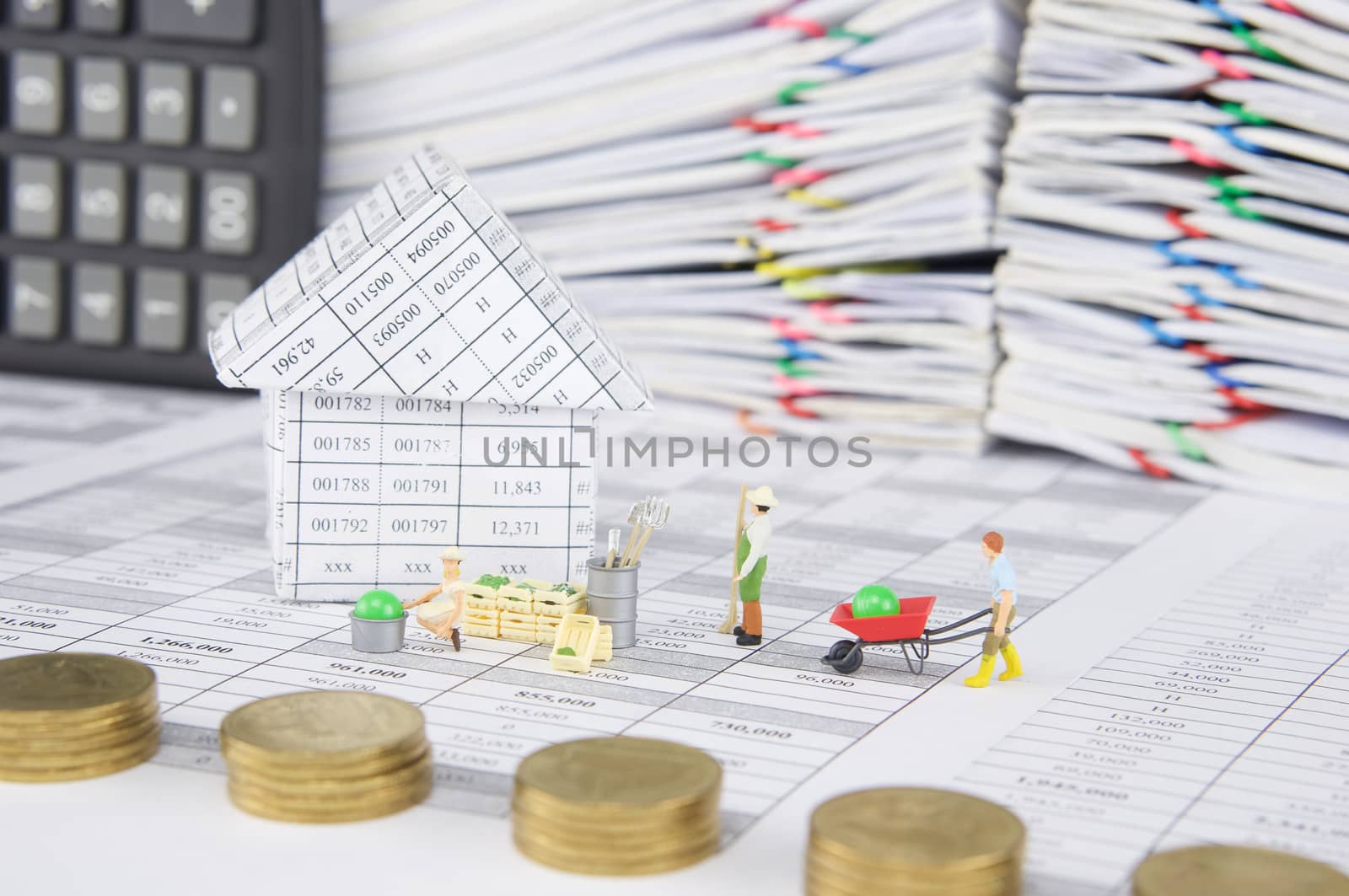 House with farmer have blur pile gold coins as foreground by eaglesky