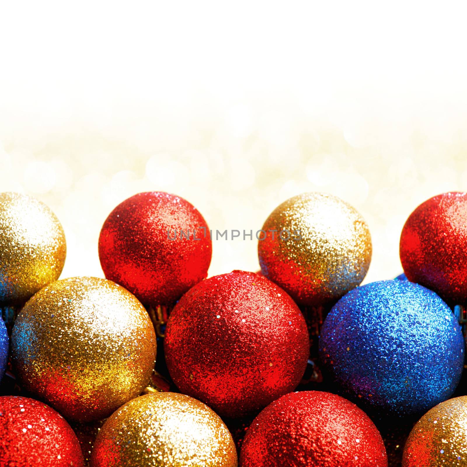 Pile of colorful Christmas balls with blurred background