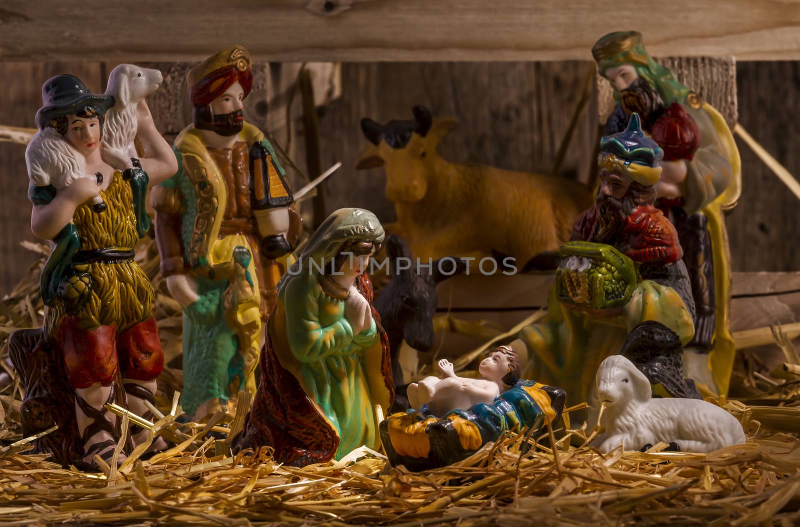 nativity scene with hand-colored figures made out of wood. Focus on  Mary!