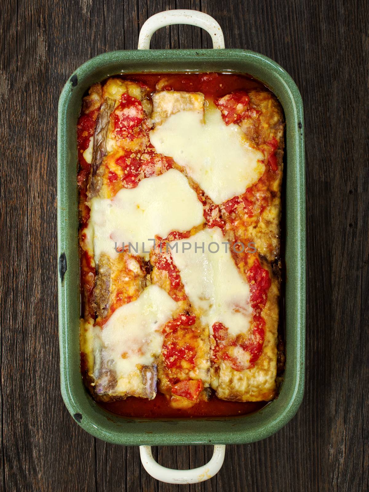 close up of rustic traditional italian eggplant parmesan