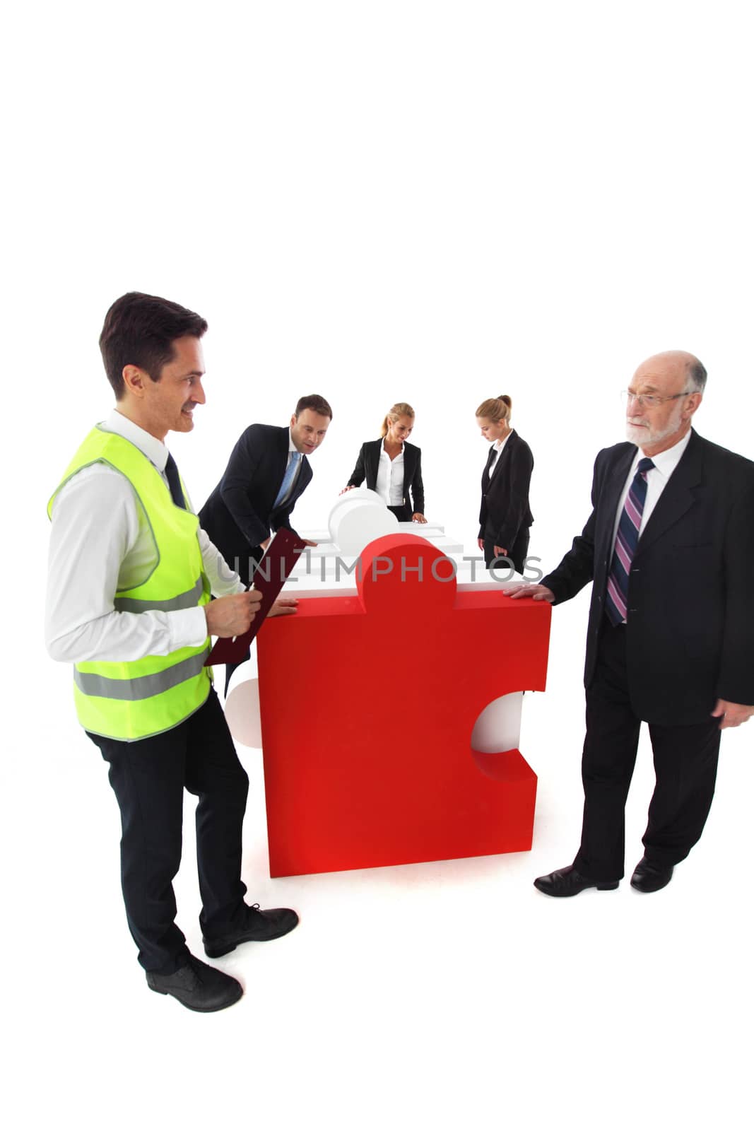 Group of business people recieving jigsaw puzzle of business isolated on white background