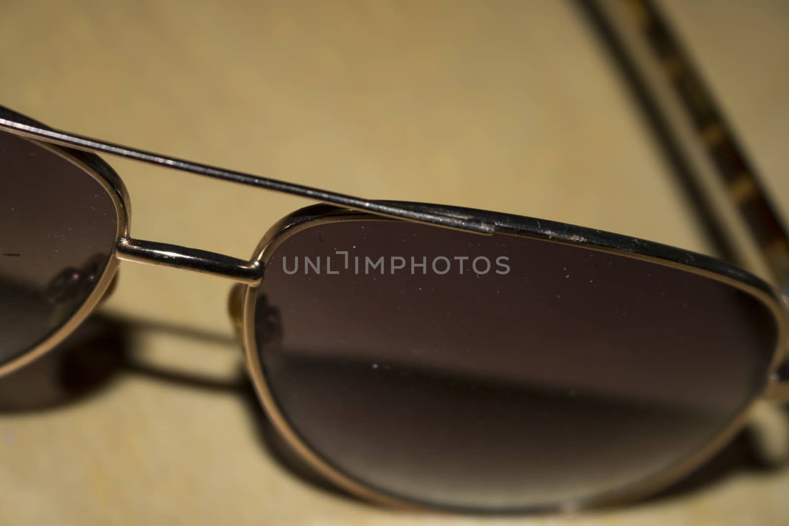Aviator sunglasses gold frame isolated on white background classic sunglasses brown lens. by vector1st