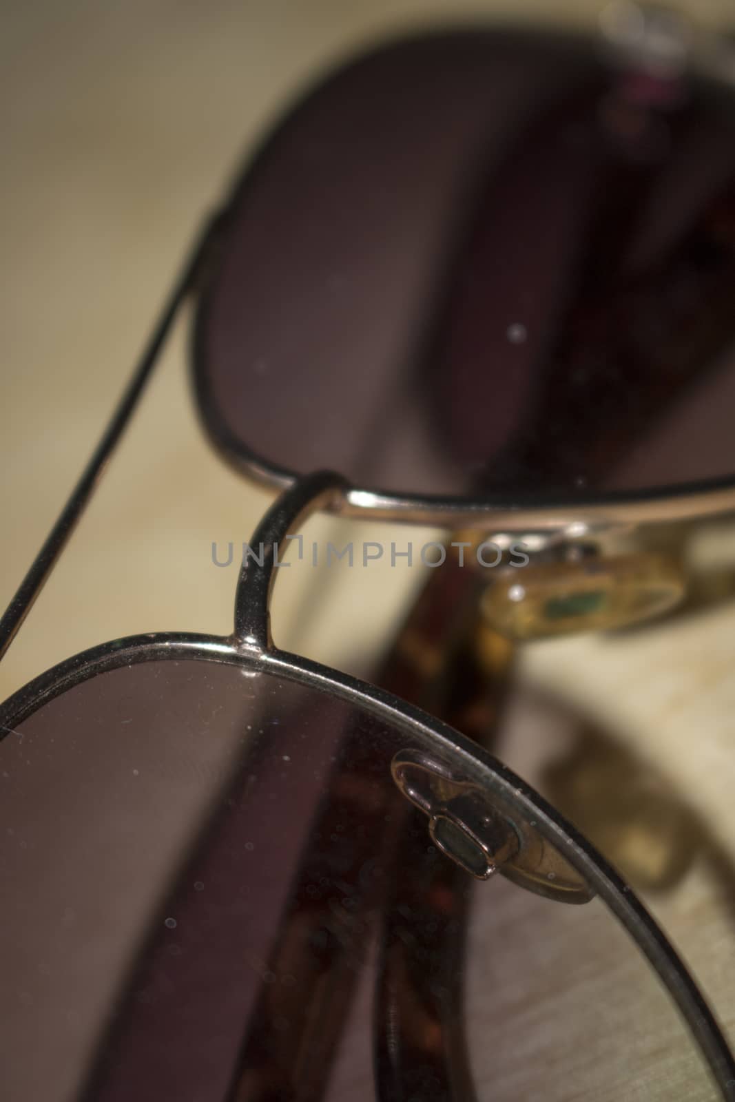Aviator sunglasses gold frame isolated on white background classic sunglasses brown lens.
