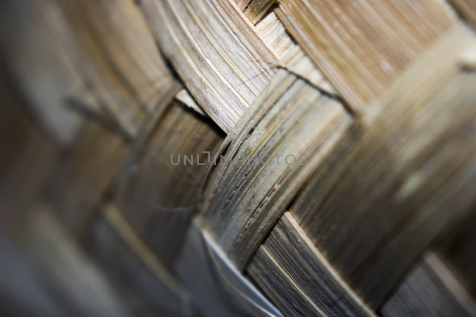 Old bamboo weave mat texture close up single focus photo