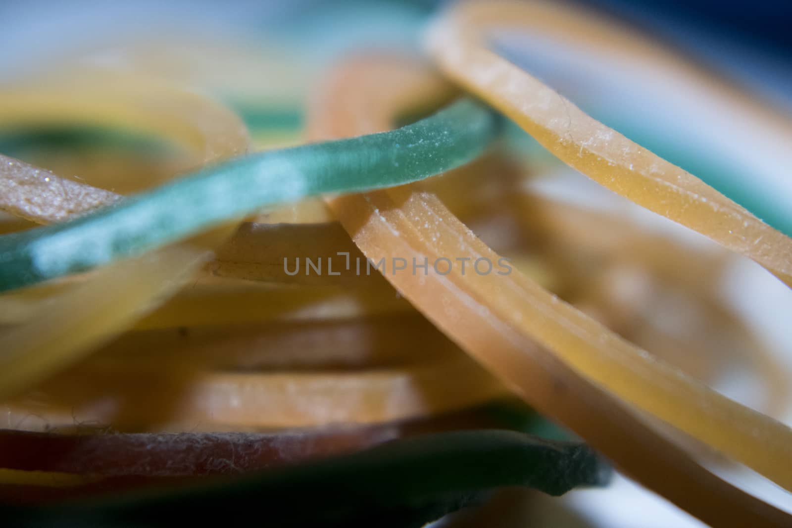A colorful rubber bands as a background close-up by vector1st
