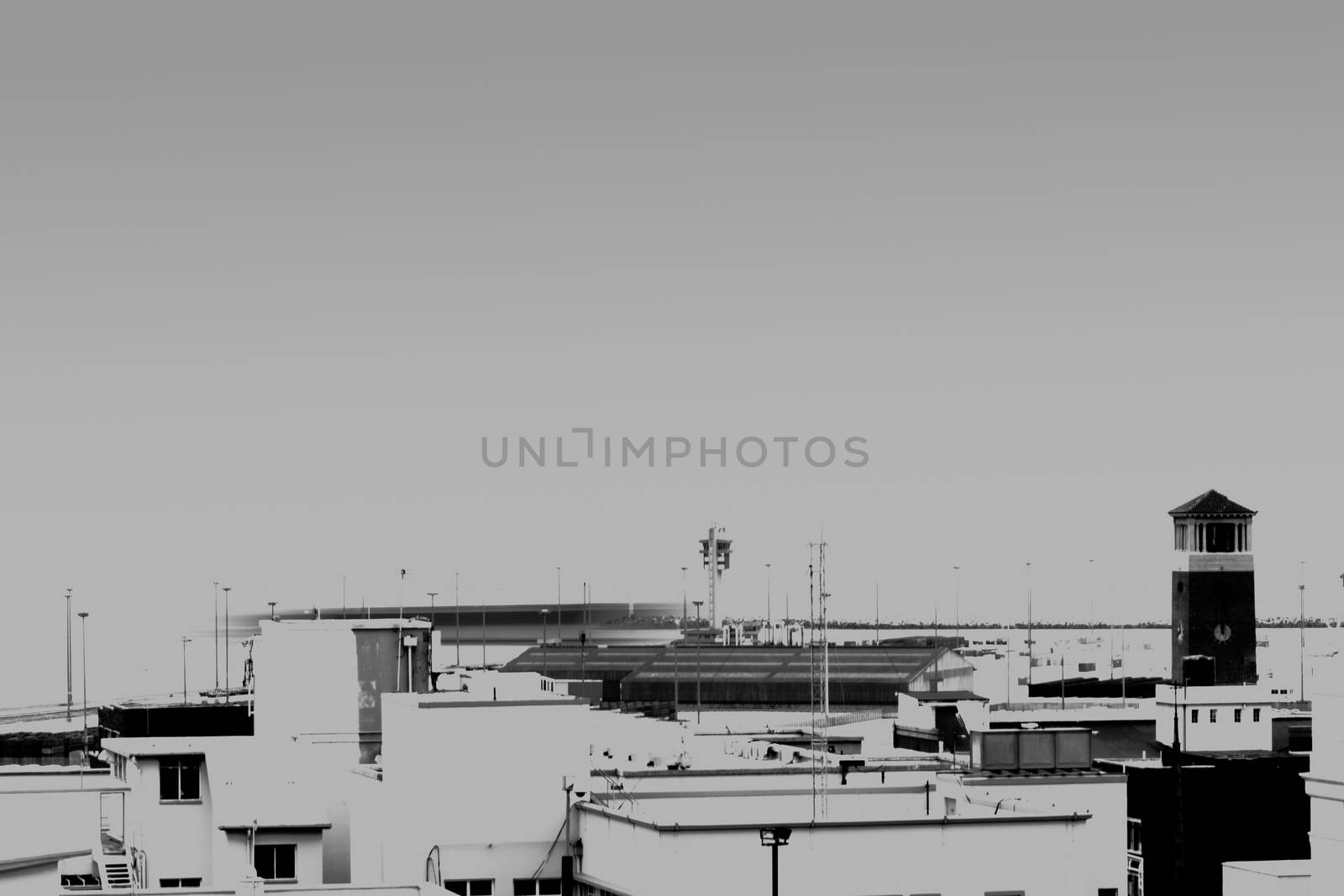 Void of colour, the Campanile Tower in Port Elizabeth with the harbor in the background.