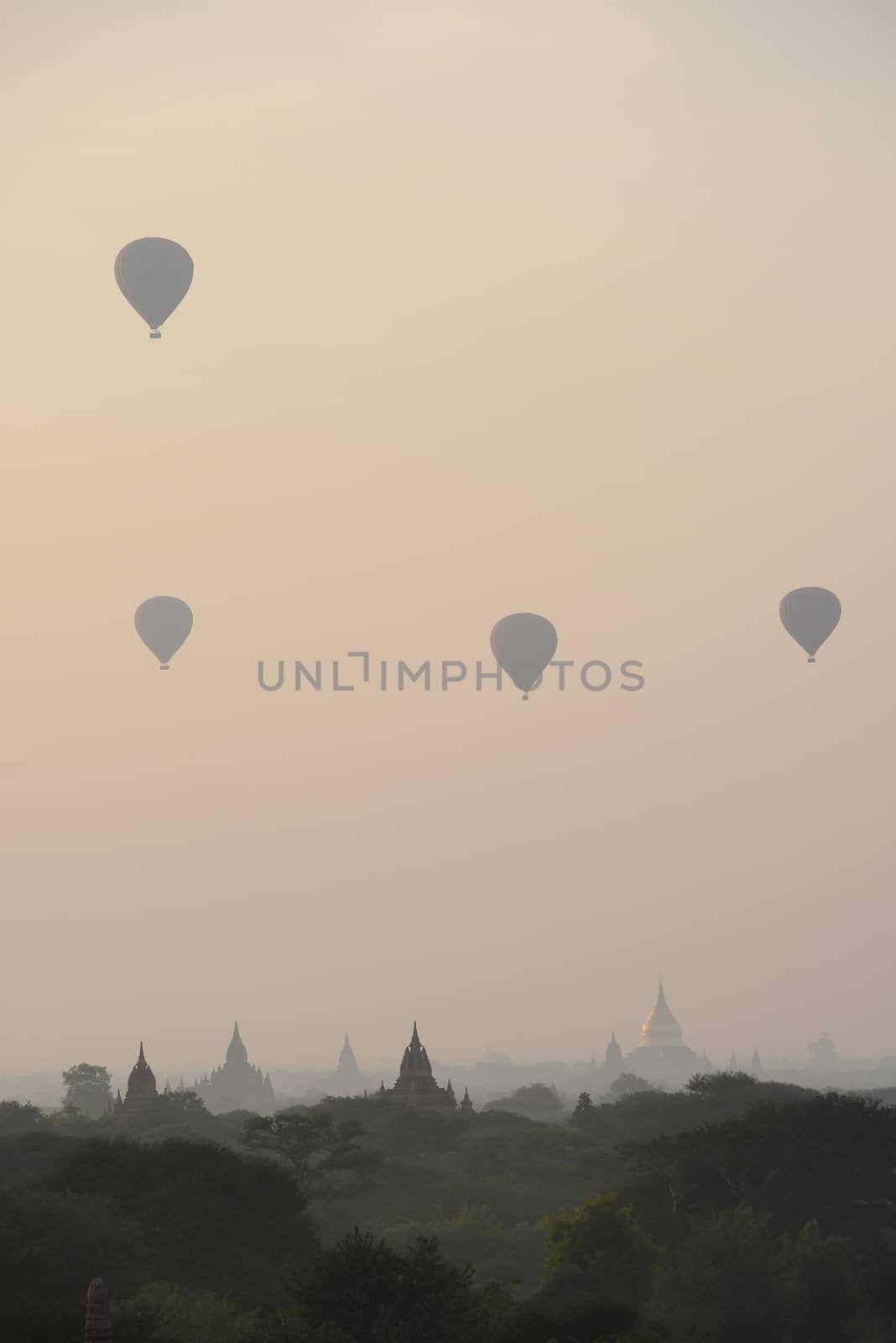 pagoda and hot air balloon in bagan myanmar in the morning