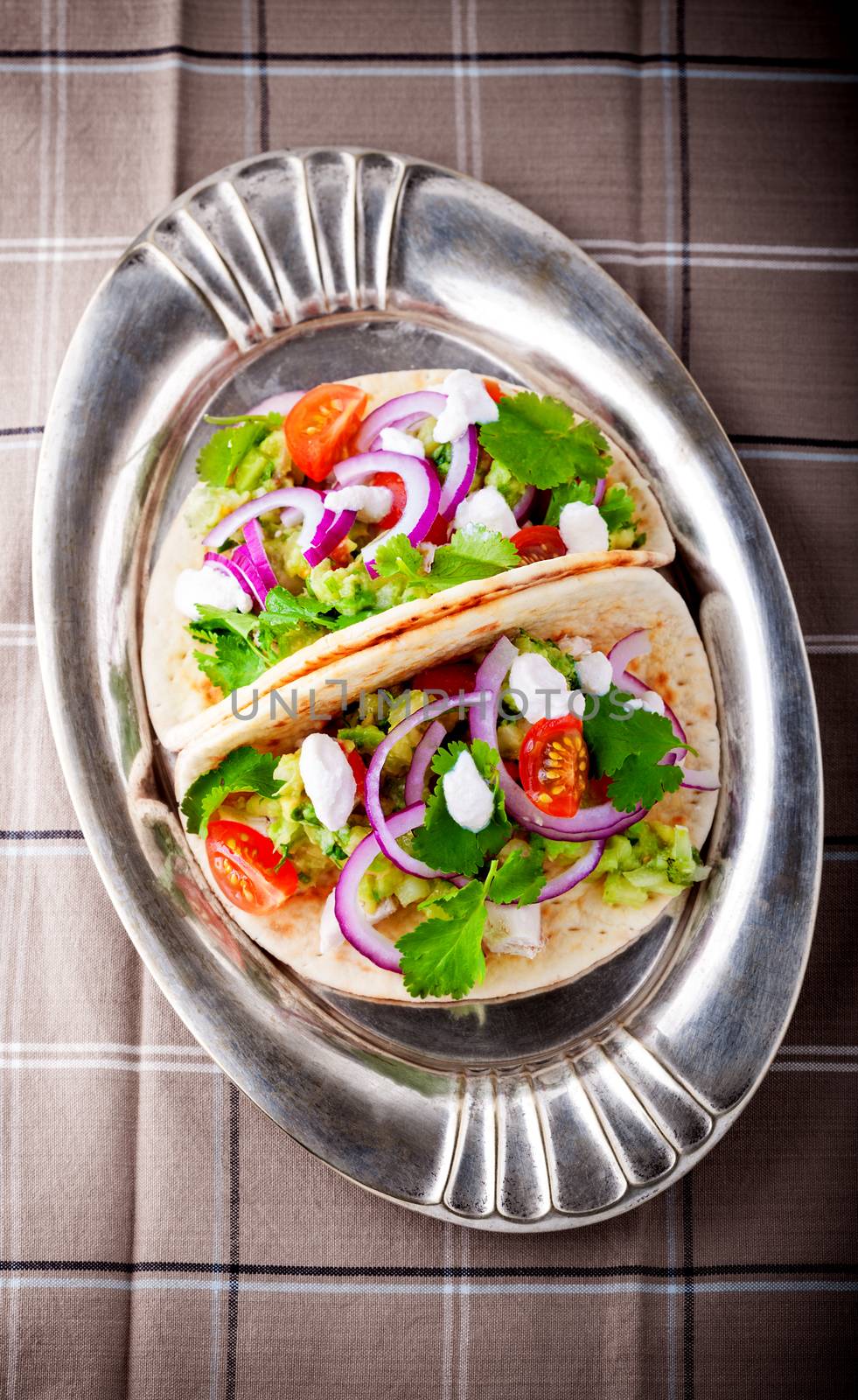 Chicken Tacos with vegetables served on the tray