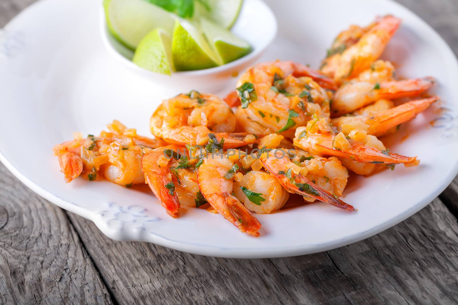 Fried Prawns served on the plate with lime