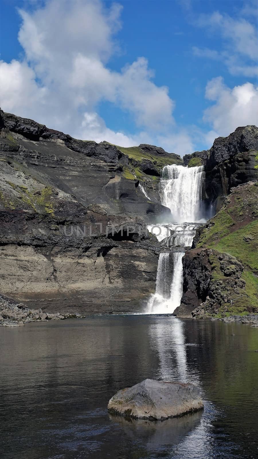 Reflection of Oferufoss waterfall, Eldgja gorge, Iceland