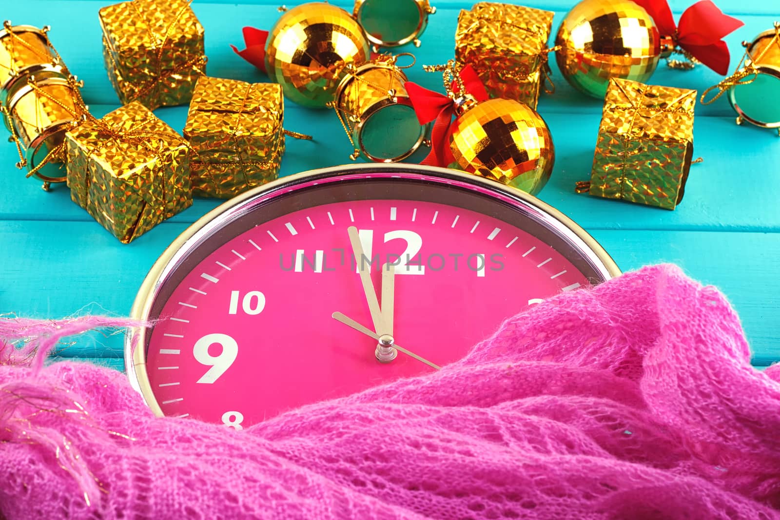 Fir tree with christmas decorations, alarm clock and gift boxes on blue background