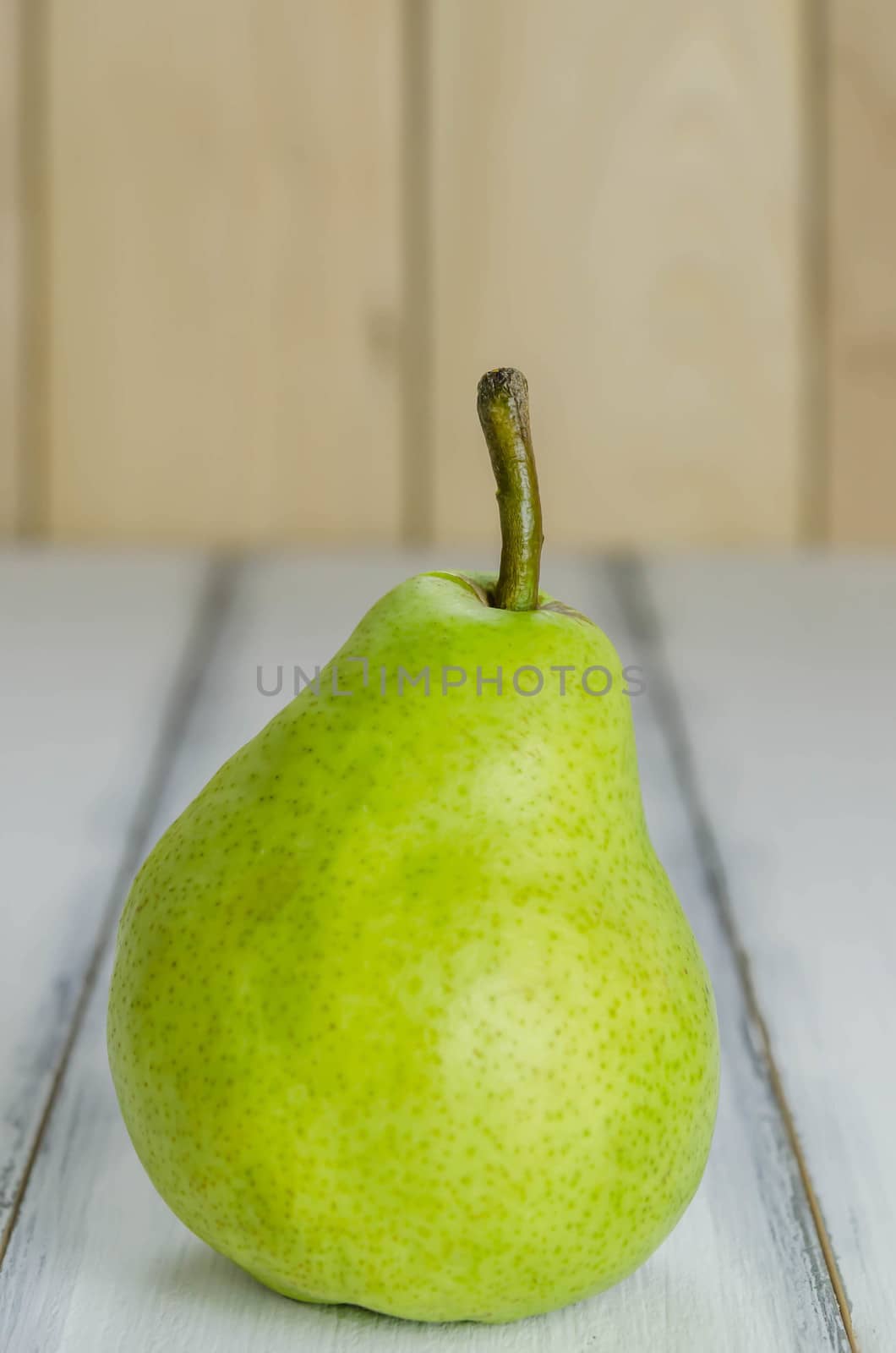 Fresh pears on the wooden background. Still life