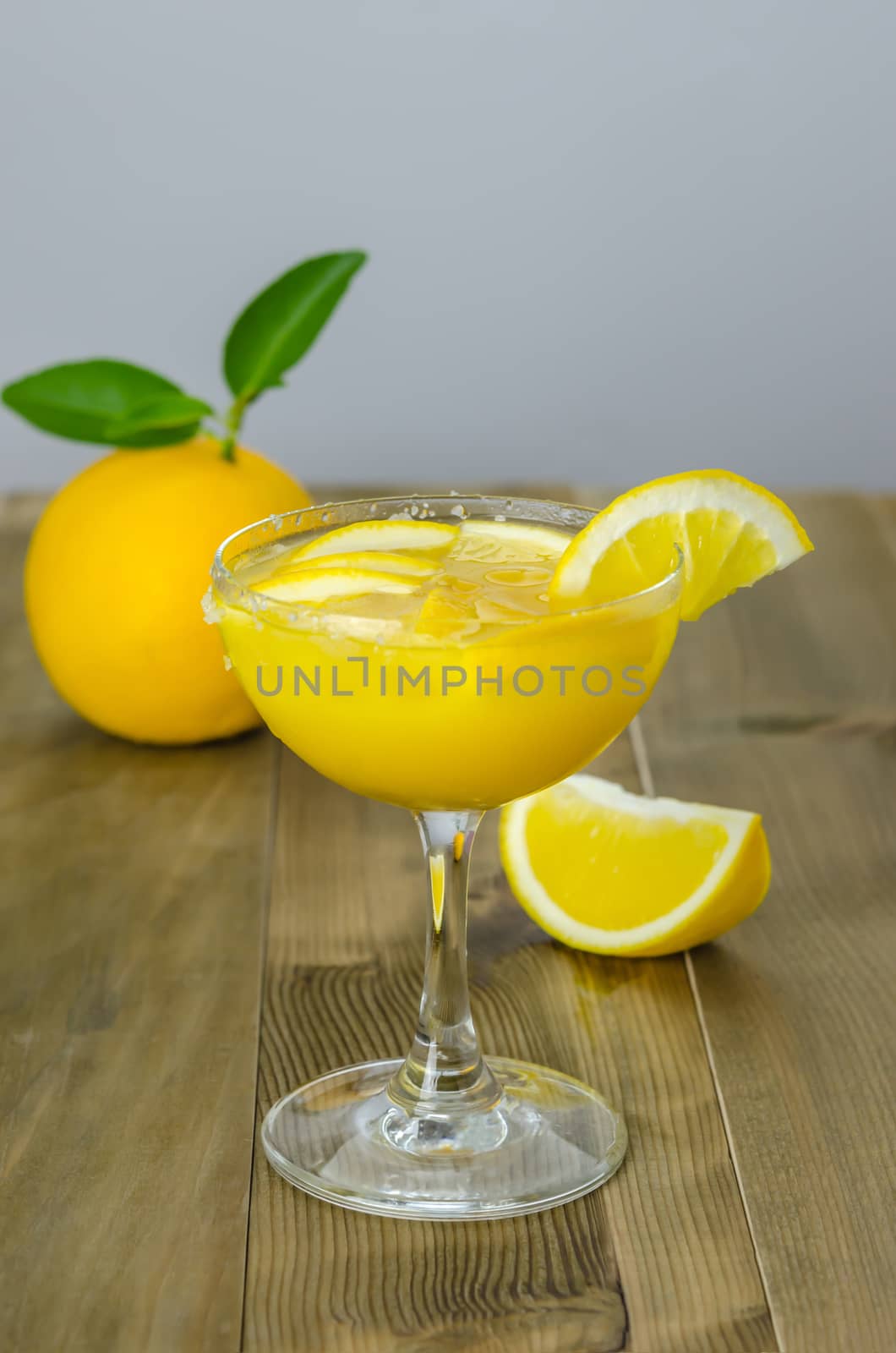 Orange juice and slices on wood