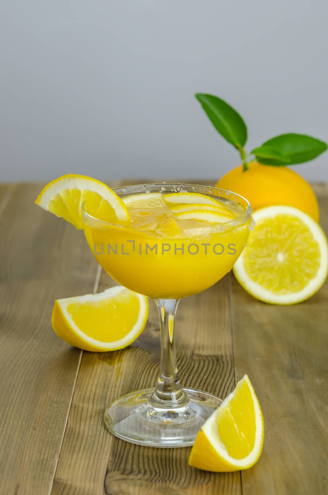 Orange juice and slices on wood