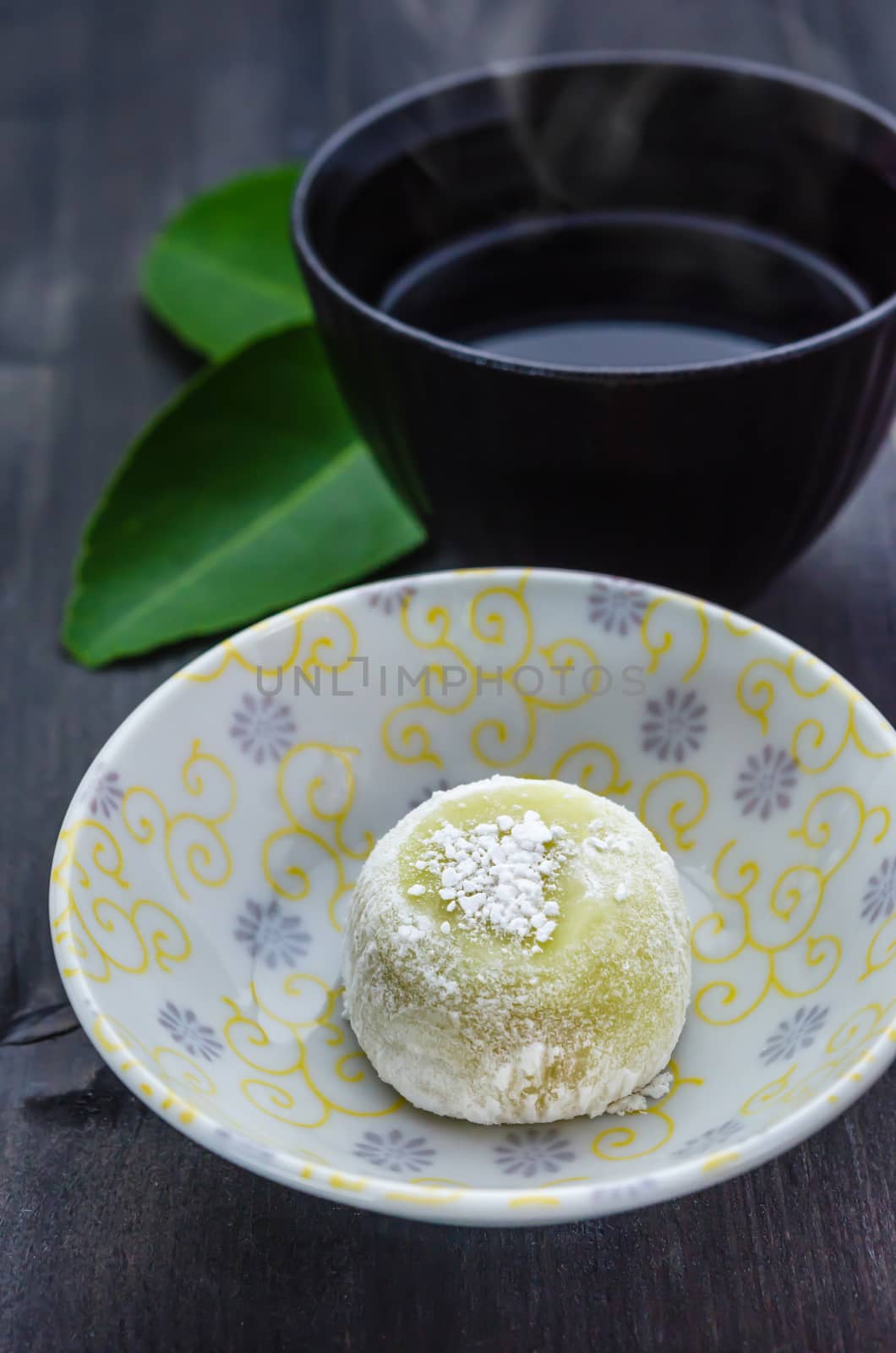 Daifuku Mochi Japanese dessert on dish with  hot tea , still life