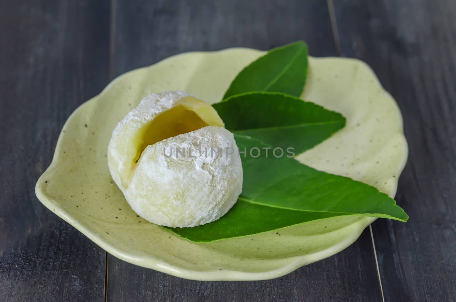Daifuku Mochi Japanese dessert on dish over wooden background