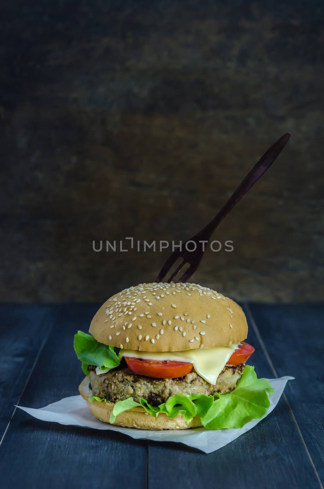 Closeup of home made burgers on wooden background