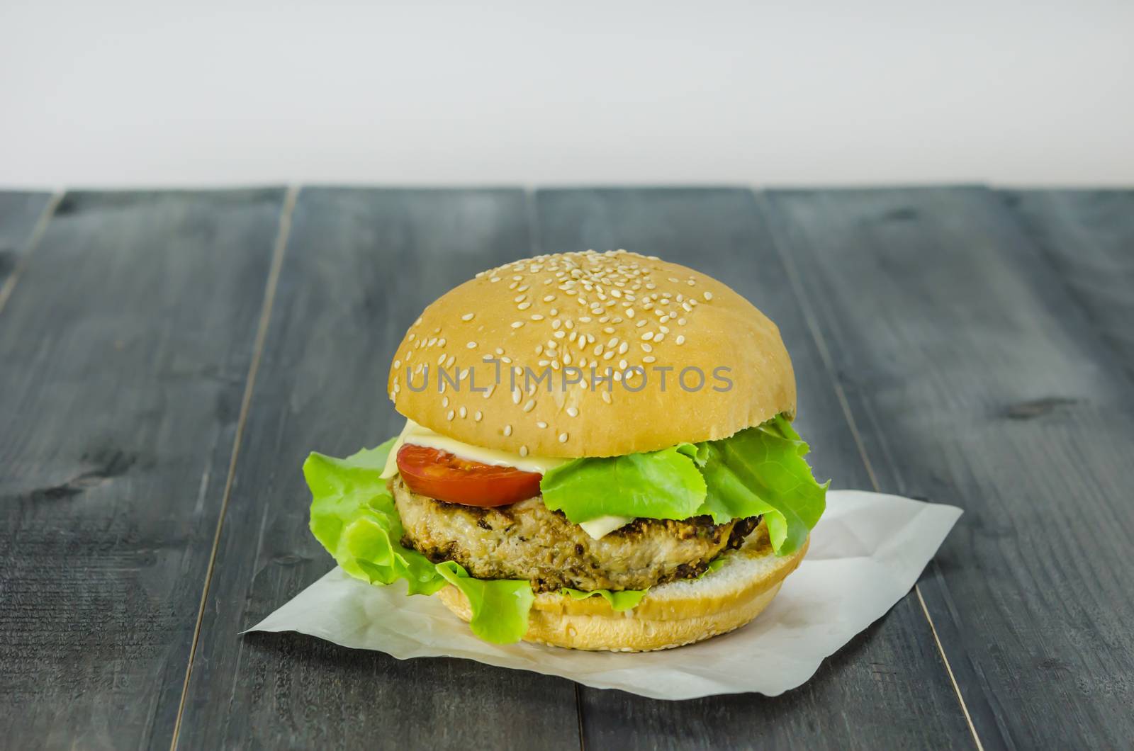 Closeup of home made burgers on wooden background