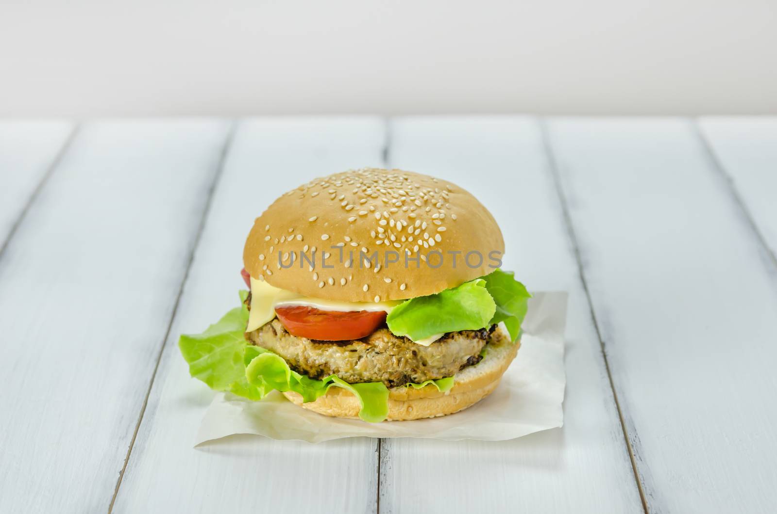 Closeup of home made burgers on wooden background