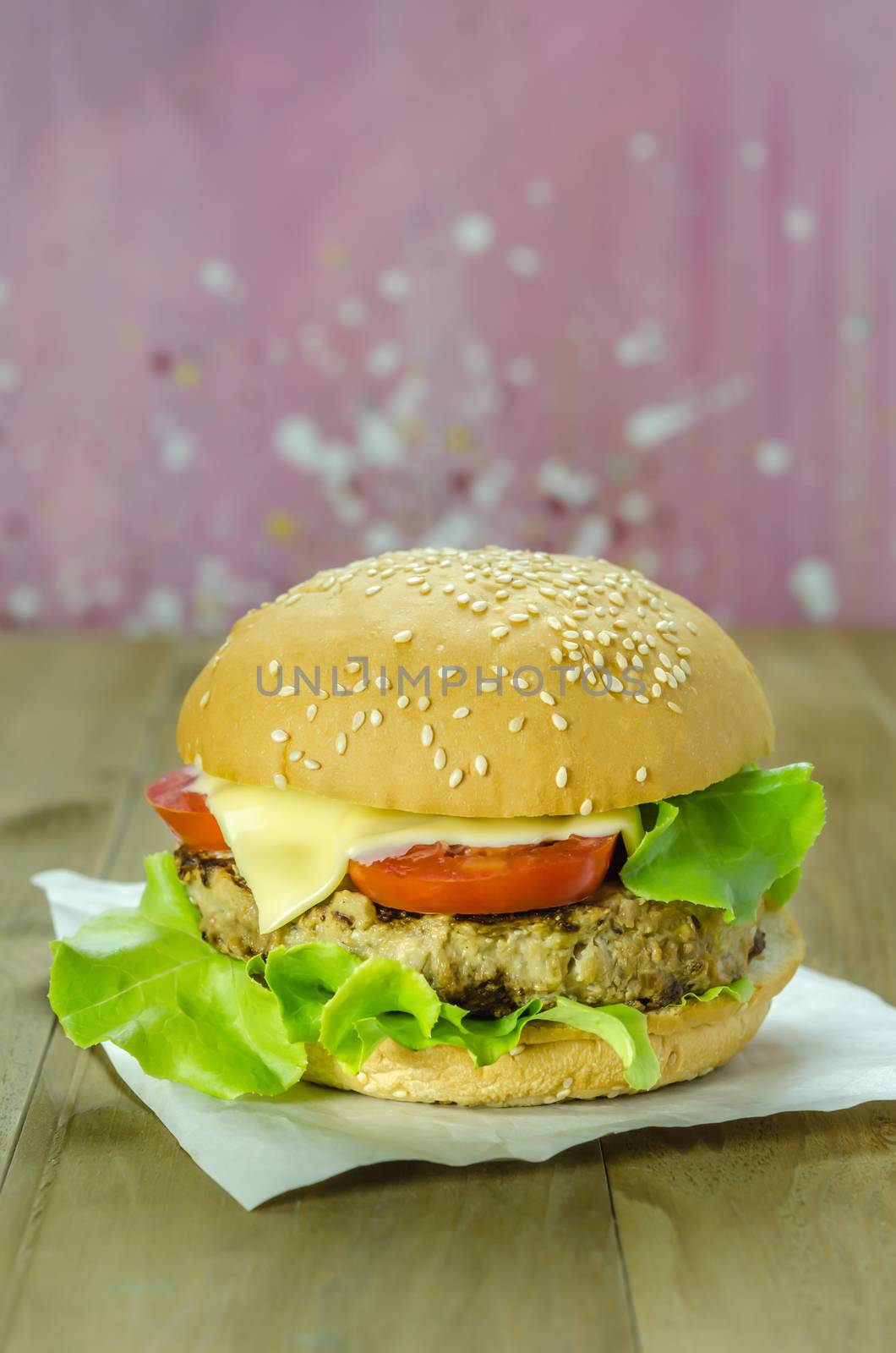 Closeup of home made burgers on wooden background