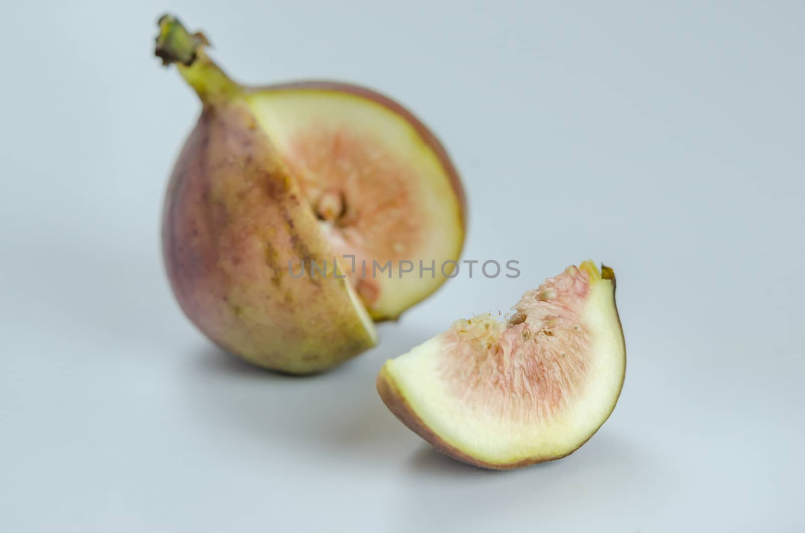 sliced fresh figs fruit on white background