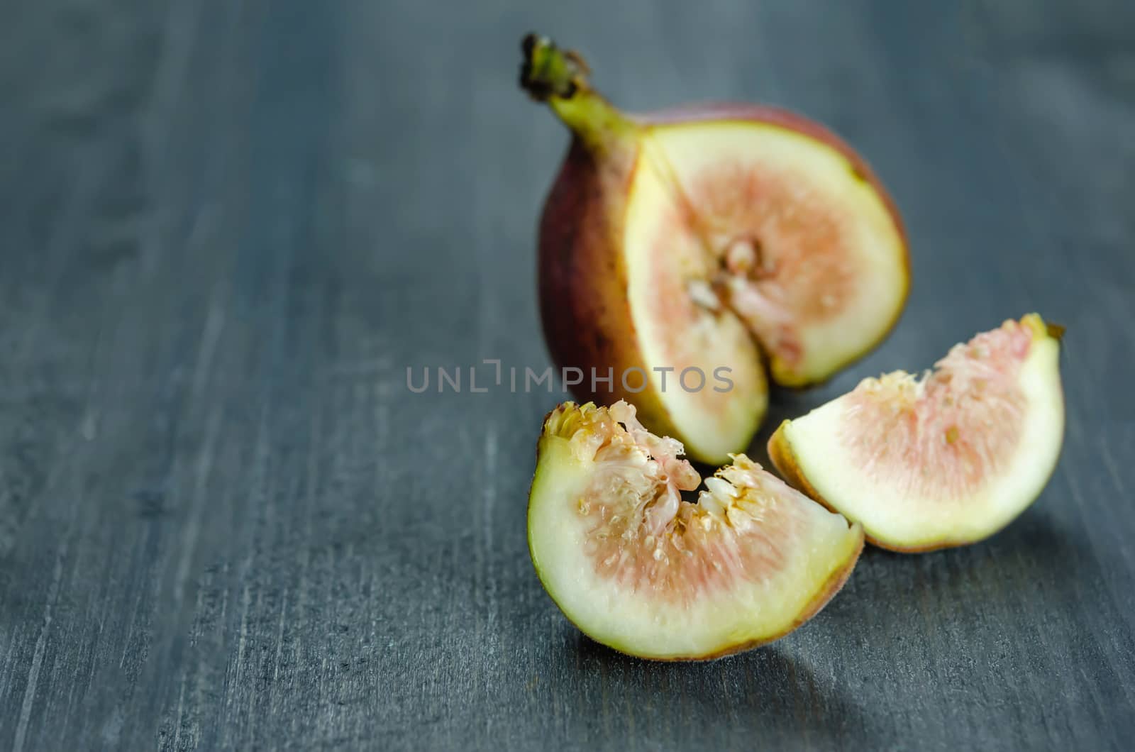 Portion of fresh Figs on wooden background