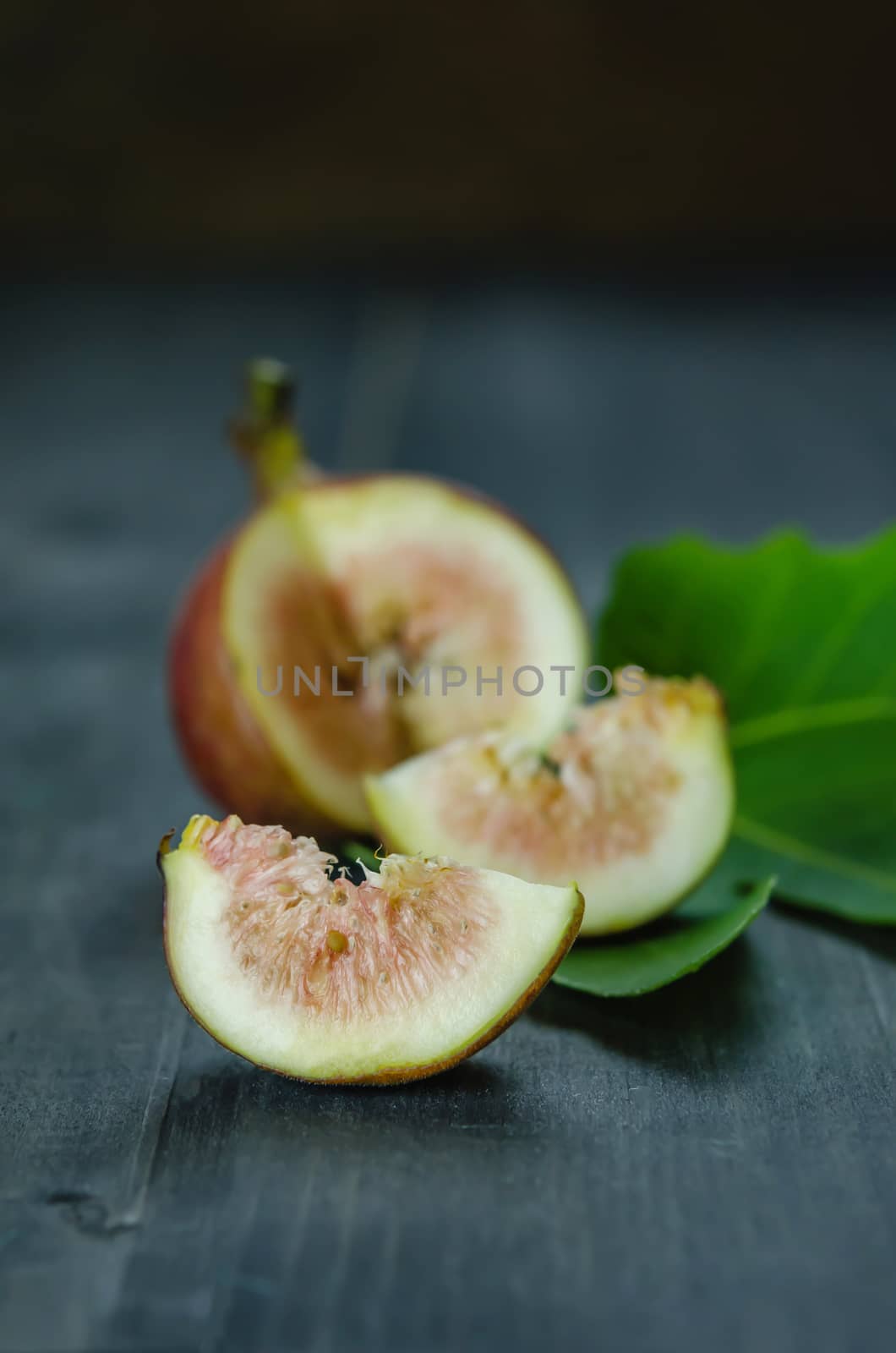 Portion of fresh Figs on wooden background