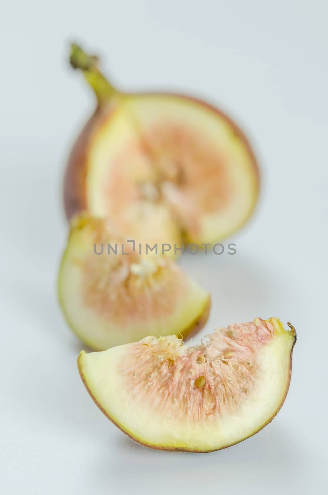 sliced fresh figs fruit on white background