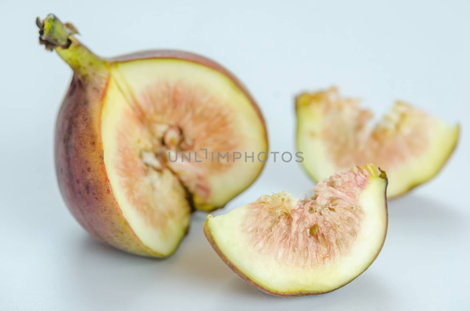 sliced fresh figs fruit on white background