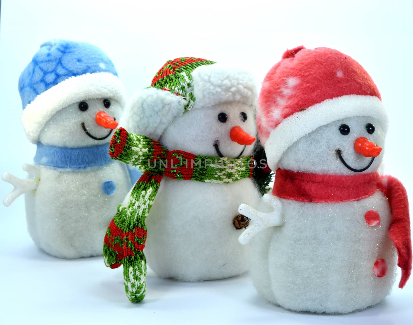 Trio of snowman in a row on a white background