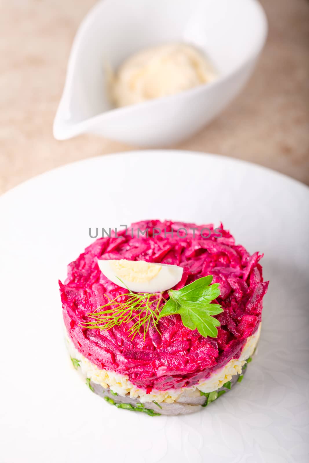 Matjes herring tartare on a white plate.