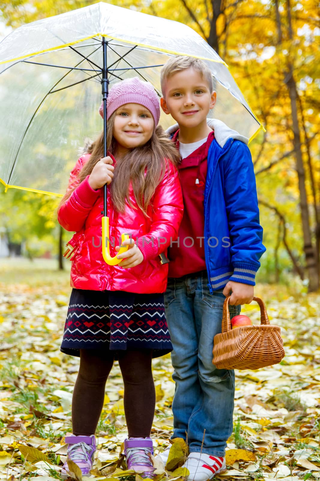 Sister and brother under umbrella by Angel_a