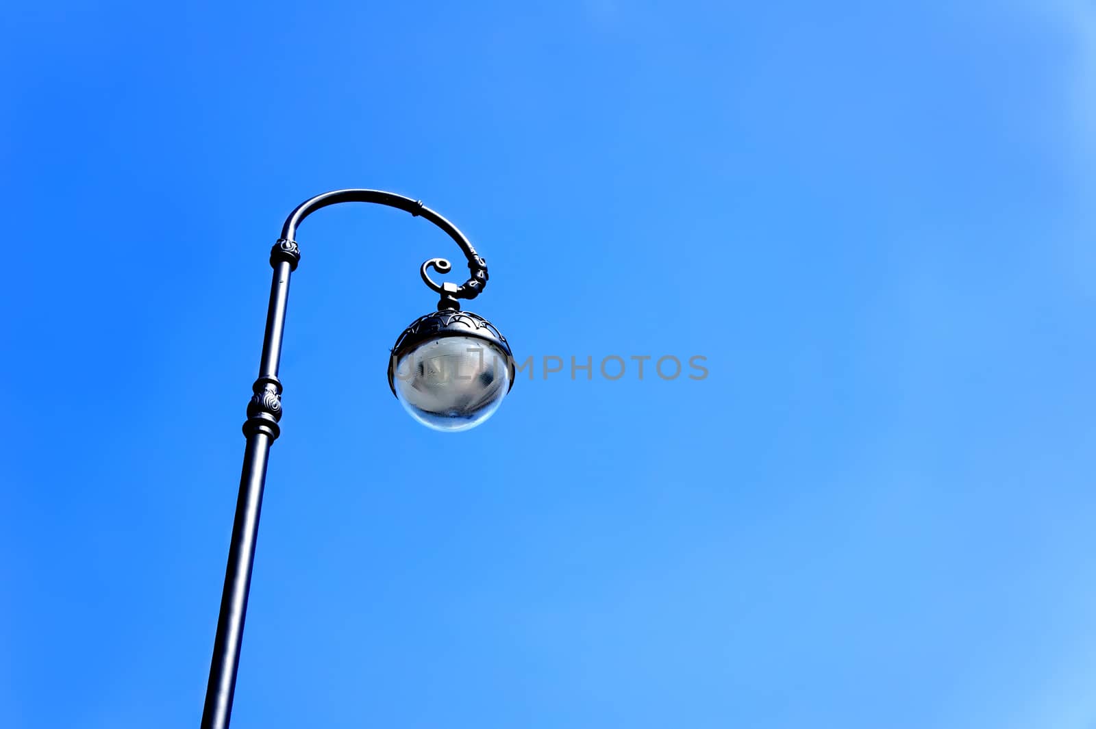 Street lamp on background of blue sky