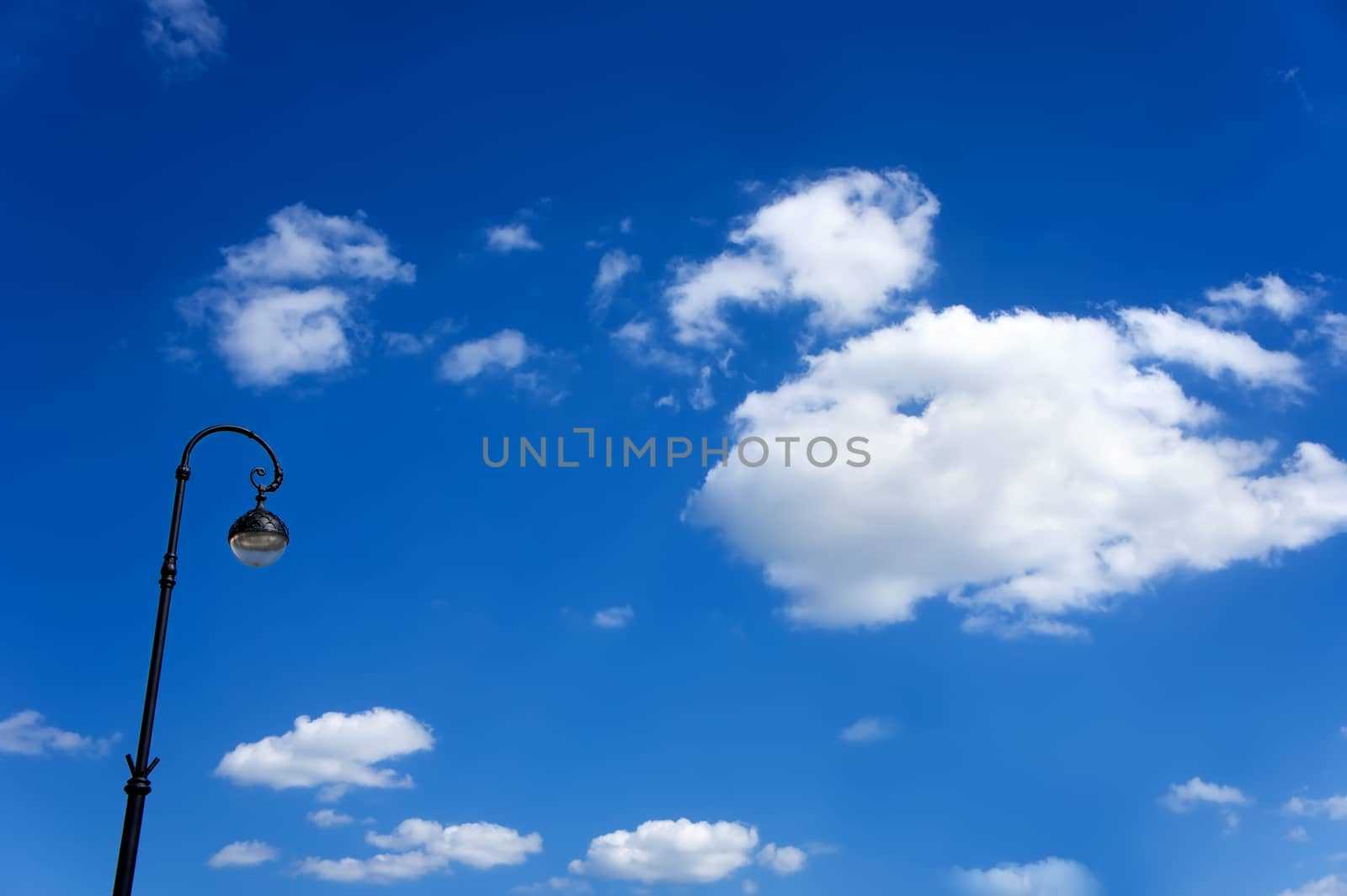 street lamppost against the blue sky by wolegsan