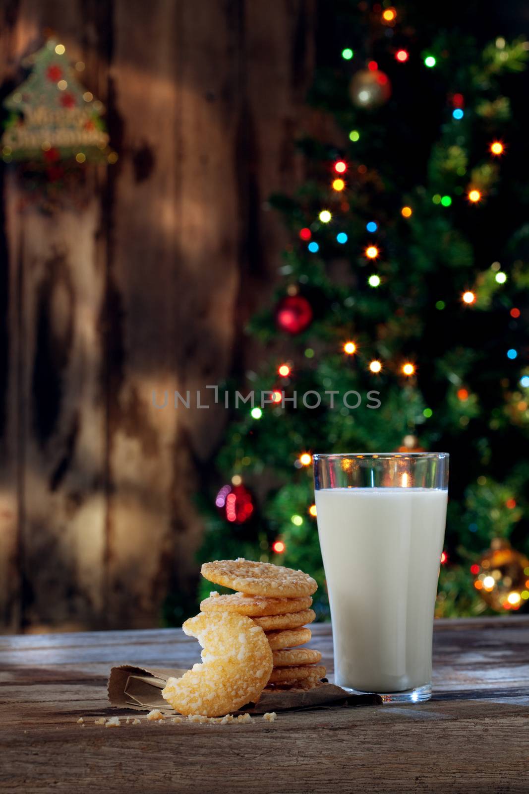close up view of glass of milk with cookies on color back