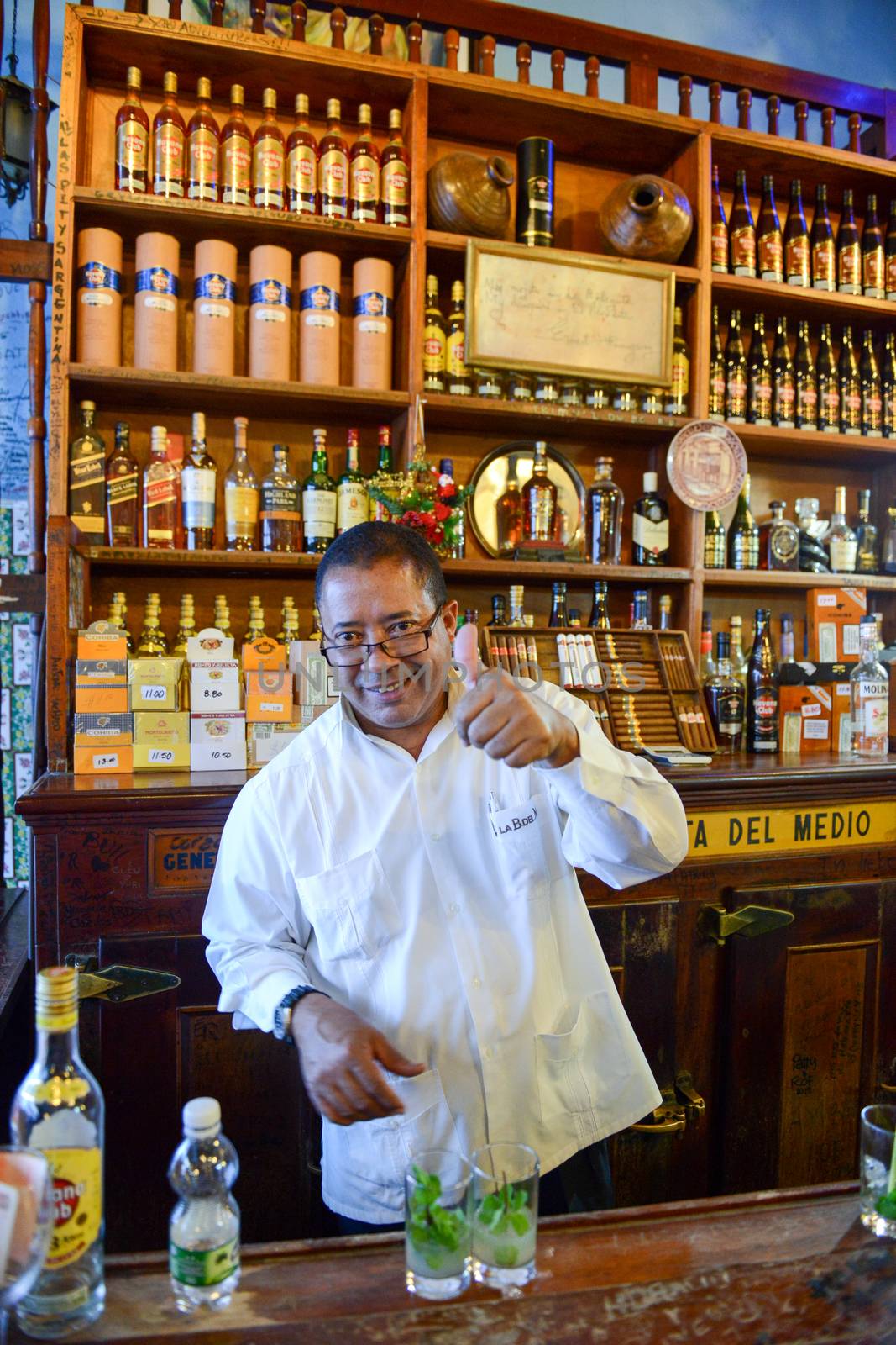Havana, Cuba - 6 january 2016 - barkeeper preparing alcoholic drinks at La Bodeguita del Medio restaurant in Old Havana, Cuba