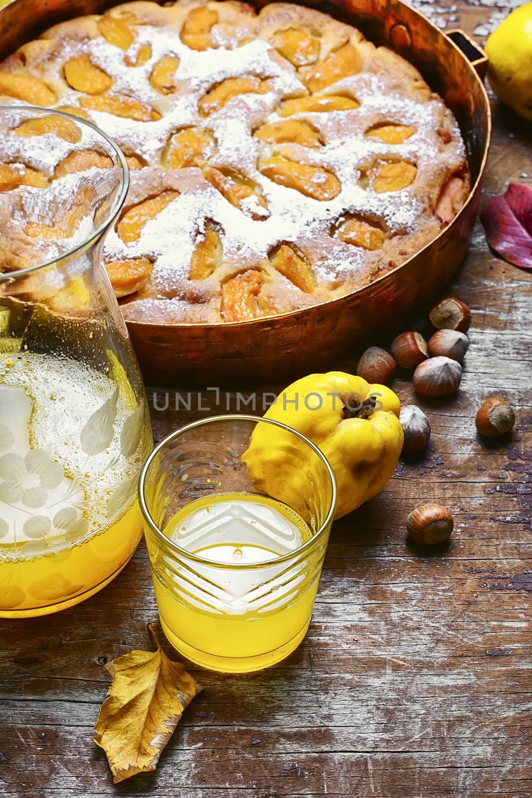 Autumn pie with ripe fruits of quince in a rustic style