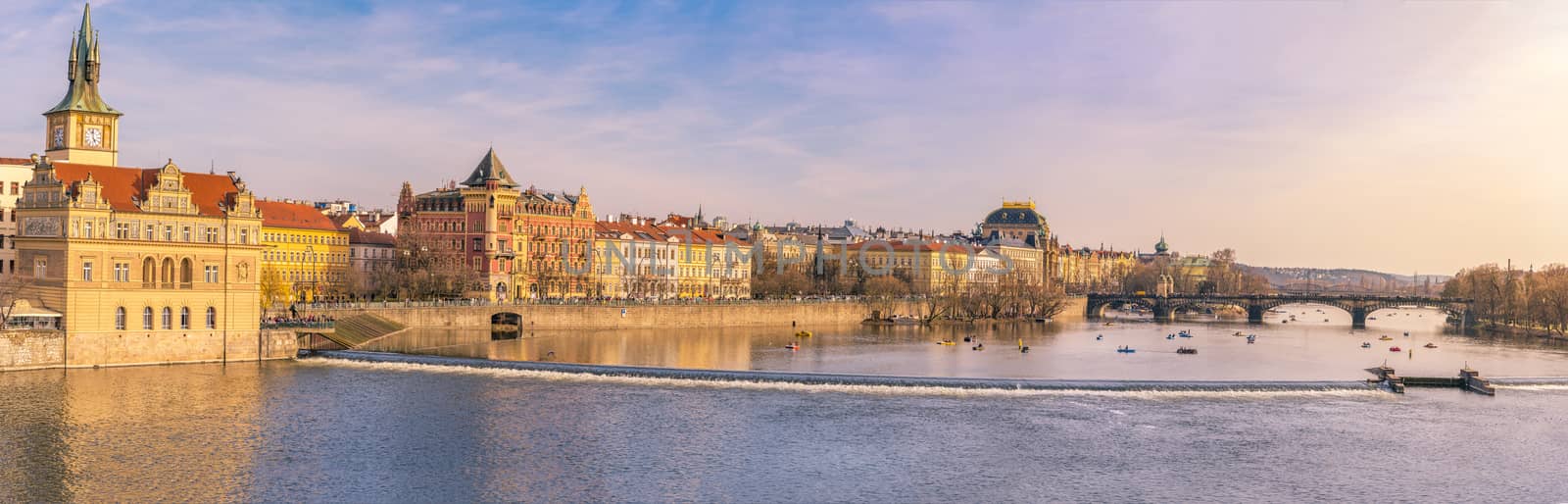 Panorama view with the buildings of Prague, the capital of Czech Republic and the Vltava river, on a sunny day of spring.