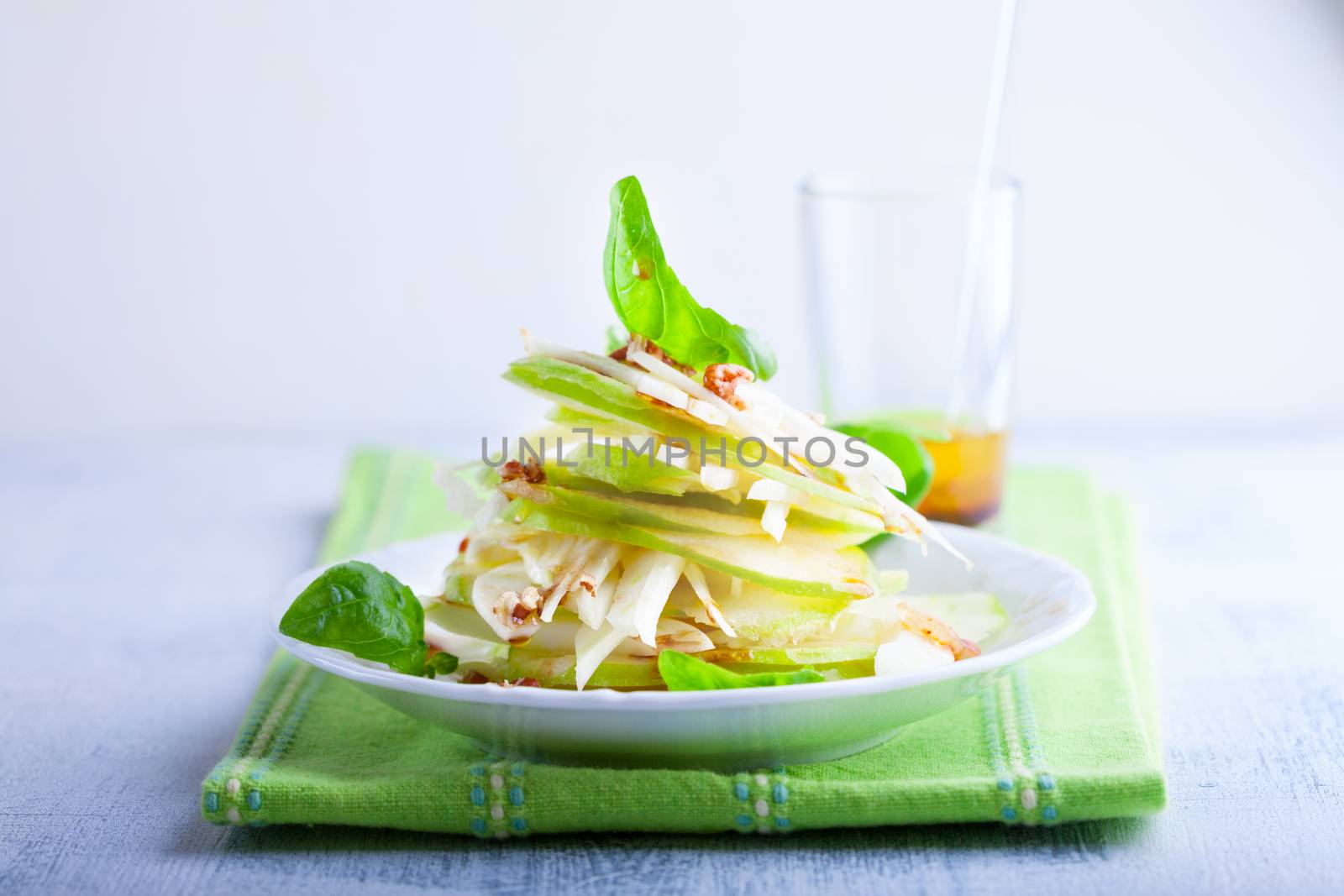 Fennel and apple salad on white plate