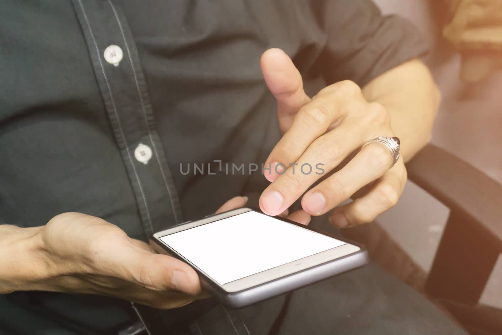 Asian business men holding and using smart phone with white blan by nopparats
