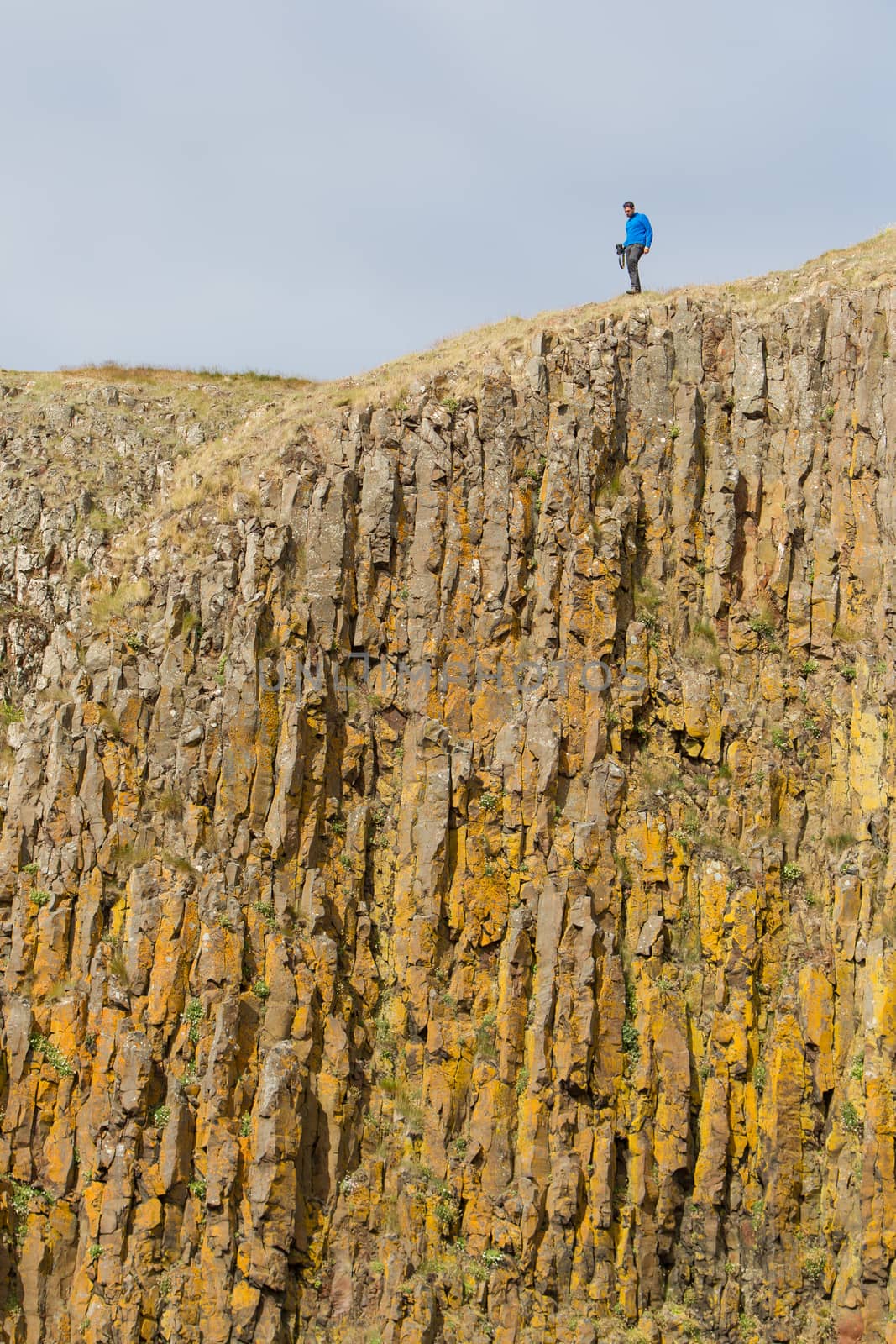 Man on the edge of the cliff - Westcoast of Iceland