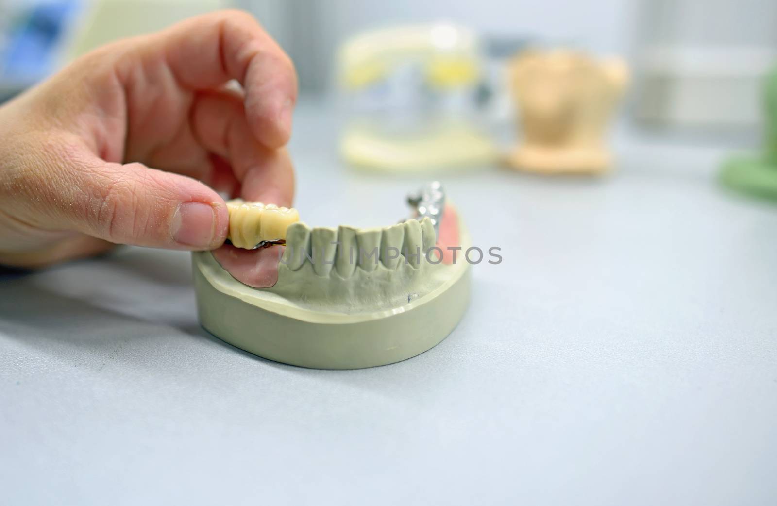 Dental technician working in dental laboratory