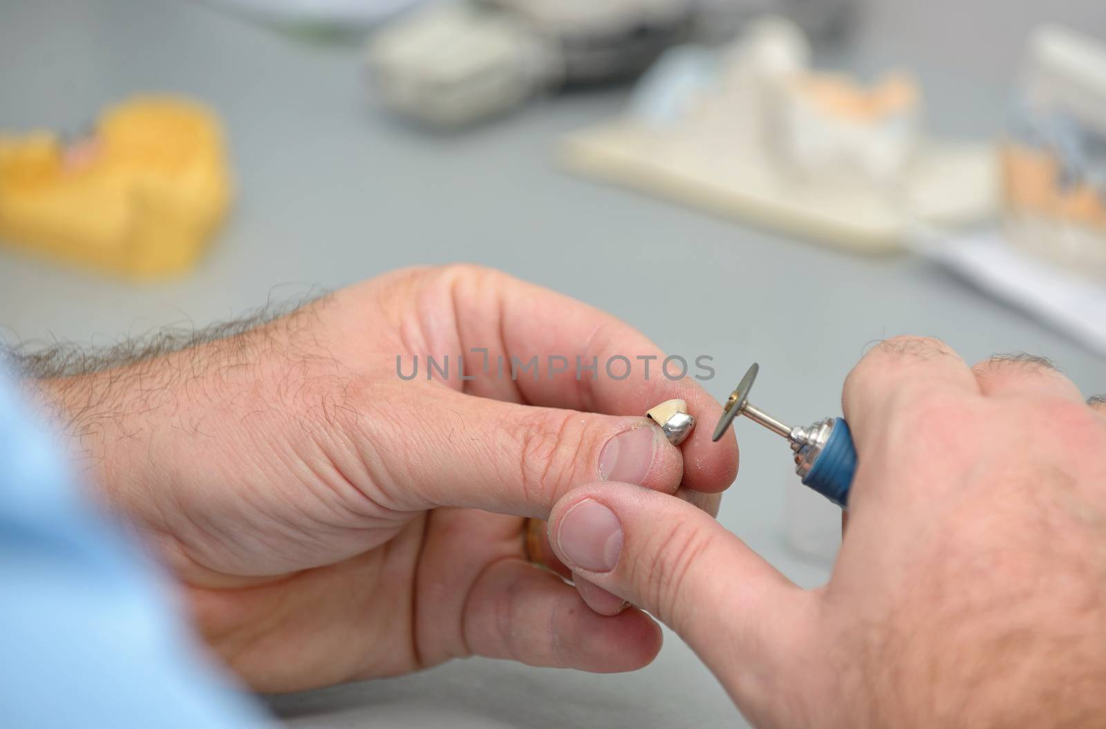 Dental technician working in dental laboratory