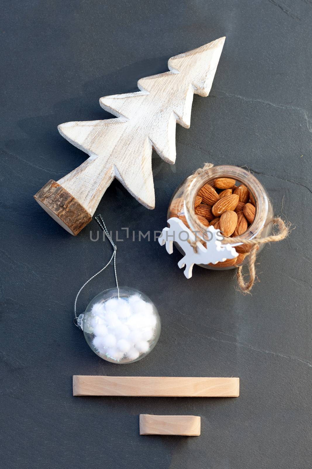 Christmas symbols including Christmas tree, almonds and toy