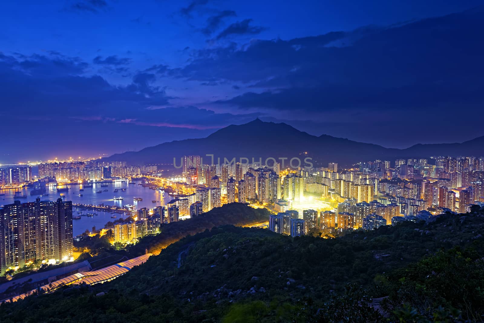 Tuen Mun skyline and South China sea at night by cozyta