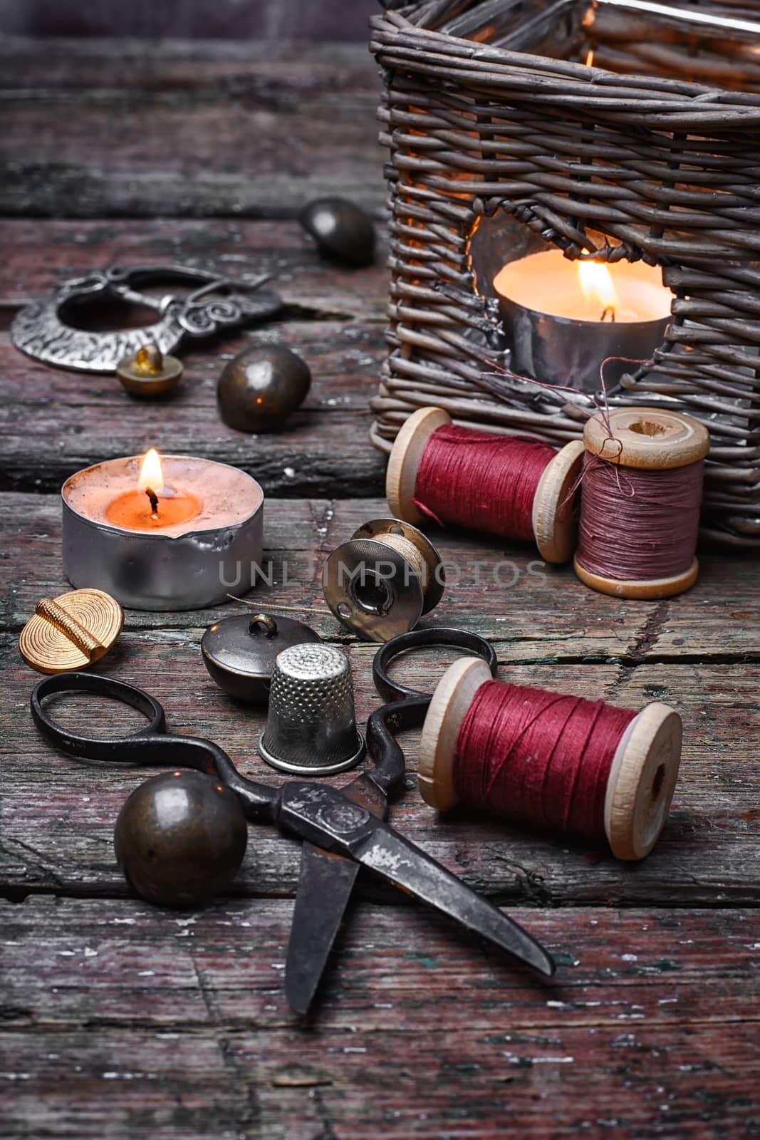 Spools of sewing threads and buttons from clothing