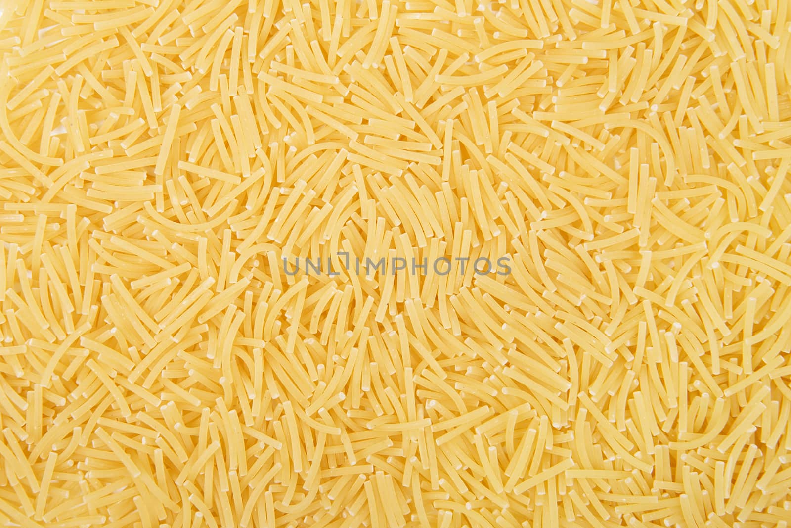 Raw vermicelli pasta background. Close-up of pastas (macaroni)